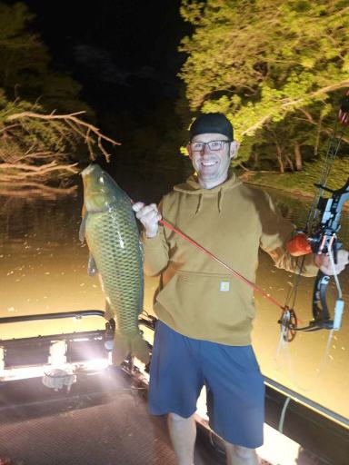 First-time shooter with a carp taken from the lit deck