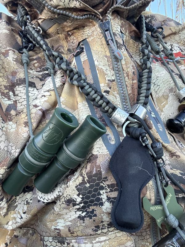 Duck calls, shells and a shotgun laid out before a hunt